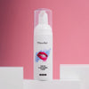 Diamond Smile tannblekningsskum mot en rosa bakgrunn